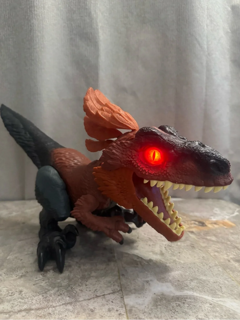Red and Black Interactive Reptile Toy with Glowing Eye